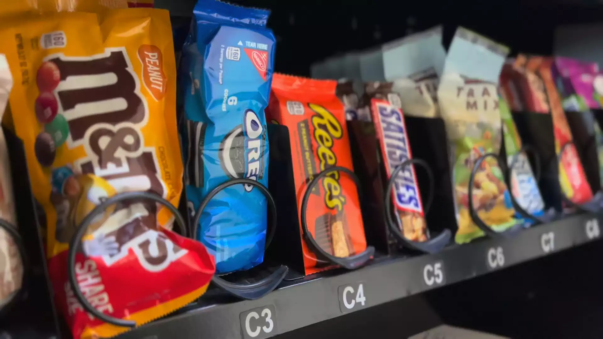 Traditional snacks including M&Ms, Oreos, Reeses in vending machine