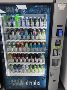 Fully stocked drink machine in a warehouse